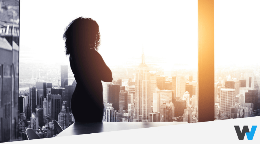 woman looking outside through a window, new york city background