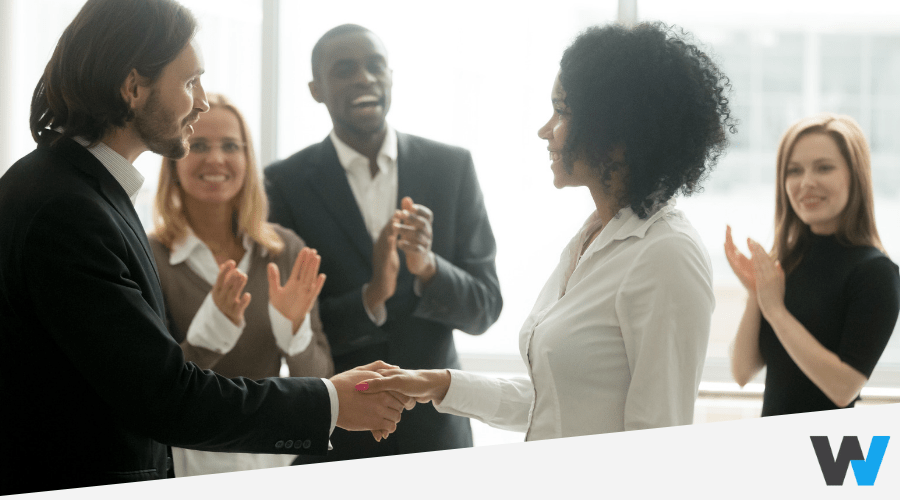 Woman receiving a promotion at work