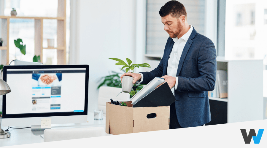 Man packing up his workspace