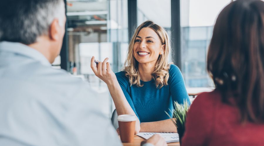 small business owner sharing business idea to two potential investors