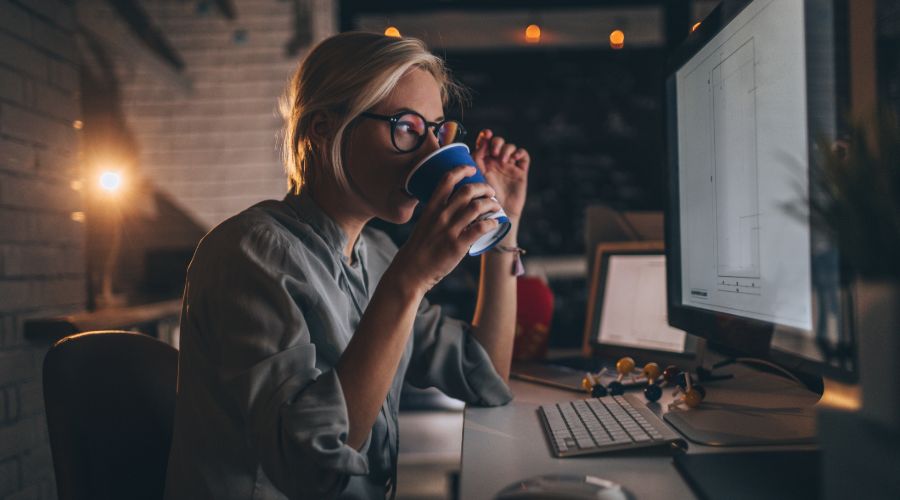 business owner works in office at night