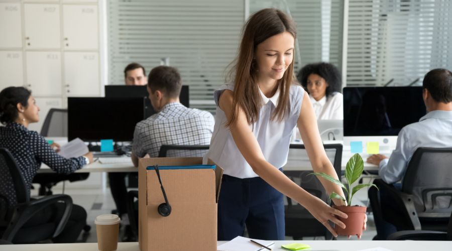 new employee setting up her desk