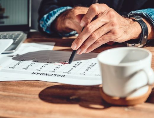 man's handing pointing to a date on the calendar as he asks for time off