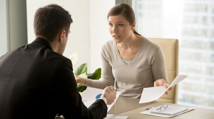 woman getting yelled at by her boss