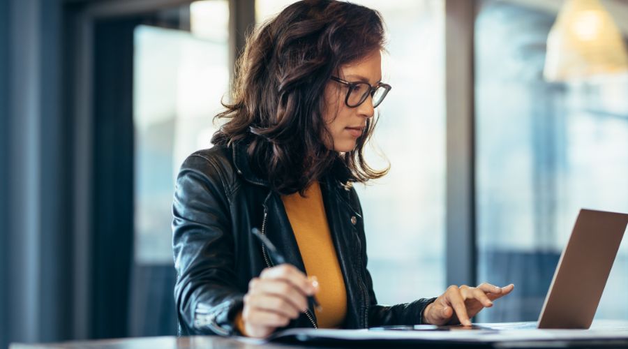 woman reviewing onboarding information on a computer