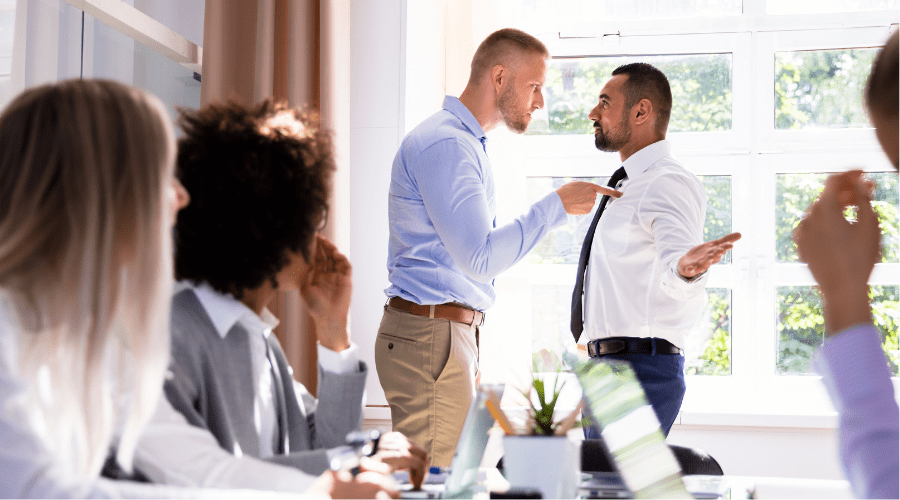 Angry employee yelling at another worker