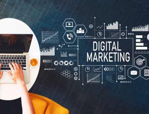 Person typing on laptop with the words digital marketing