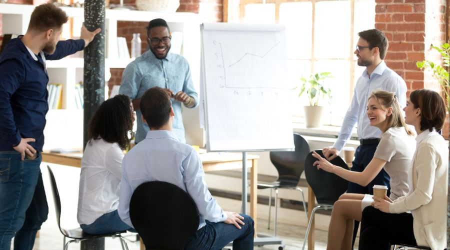 small business team having laughing and having fun at a casual meeting