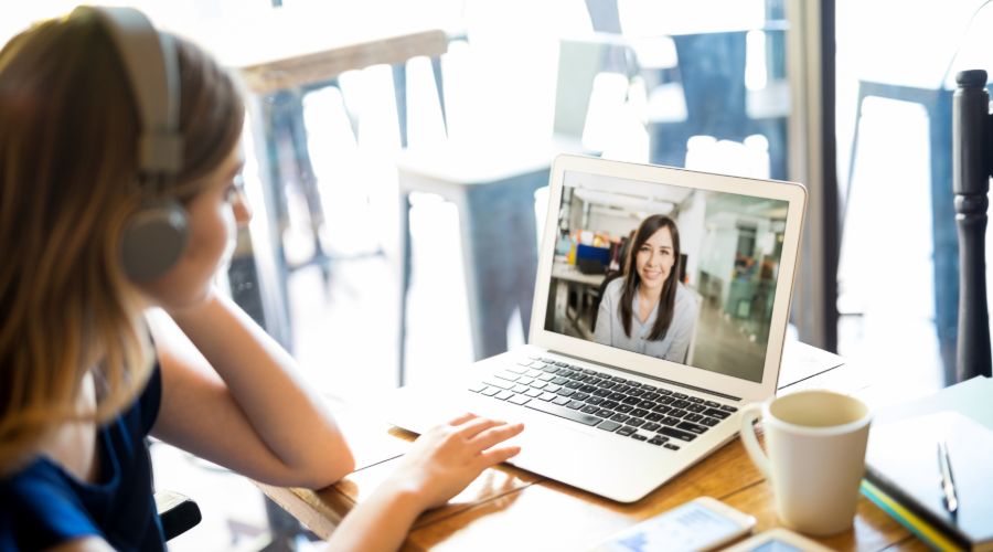 Remote employee video conferencing with her boss