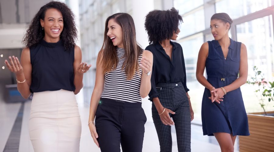 Female business owners talking and laughing