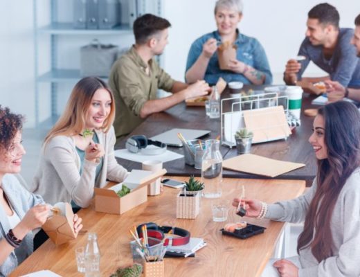 Coworkers chatting during lunch break