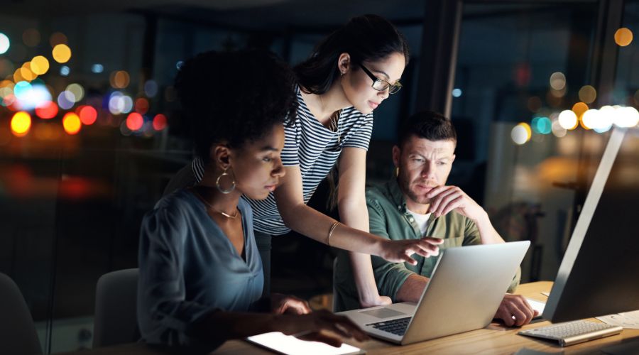 Small business employees working overtime late at night