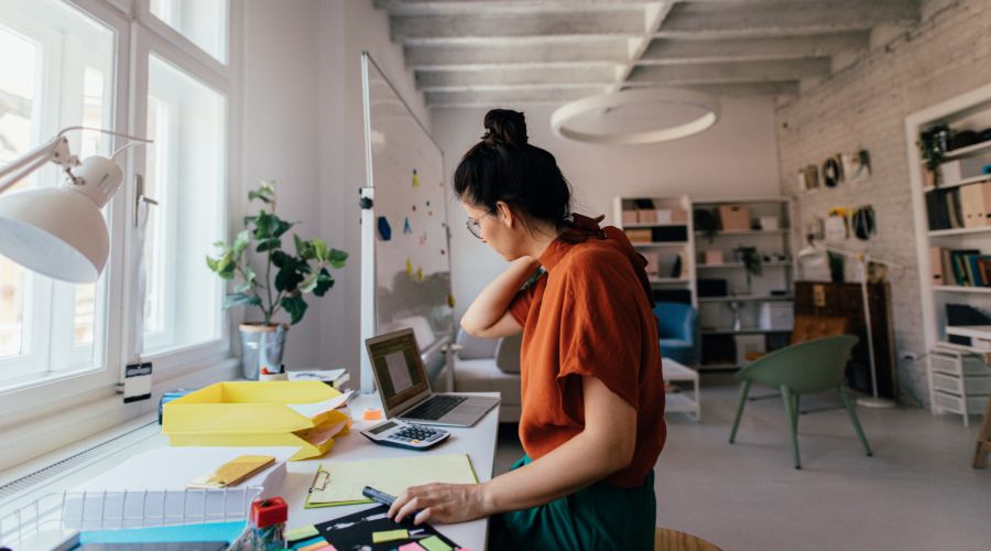 Female independent contractor woman working in a modern office